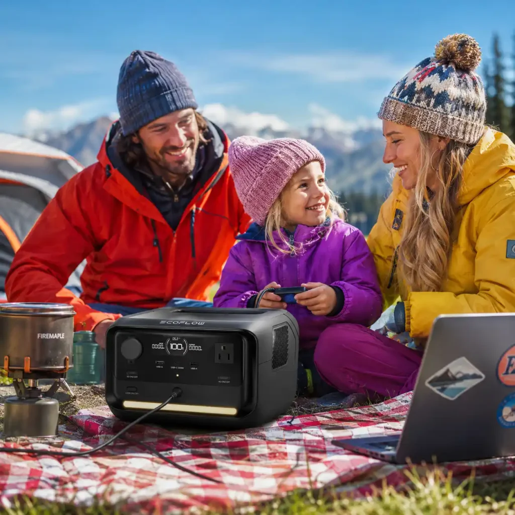 EcoFlow RIVER 3 Plus portable power station powering a laptop, camera equipment, and drone during a scenic van life camping trip in the mountains.